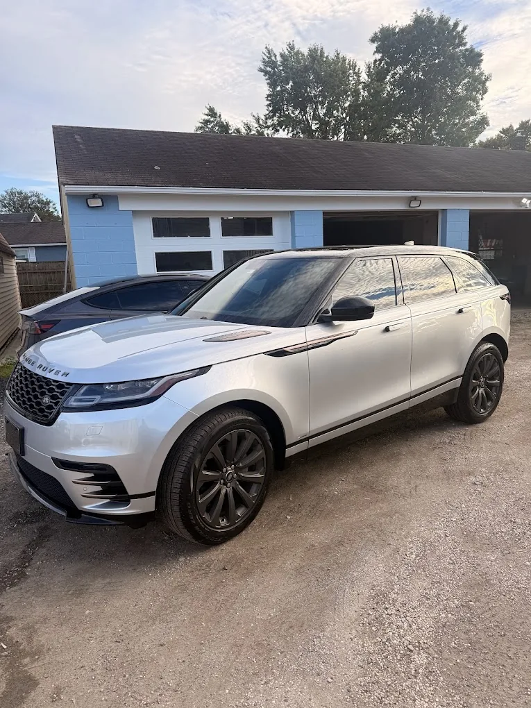 White SUV outside Premium Tints & Wraps